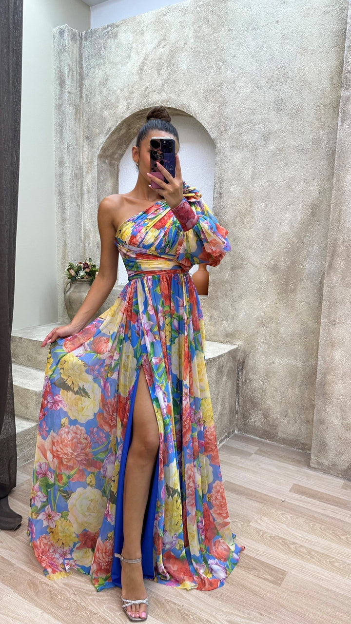 Flowy one-shoulder maxi dress for women, featuring a vibrant floral print and elegant design for a unique summer look.