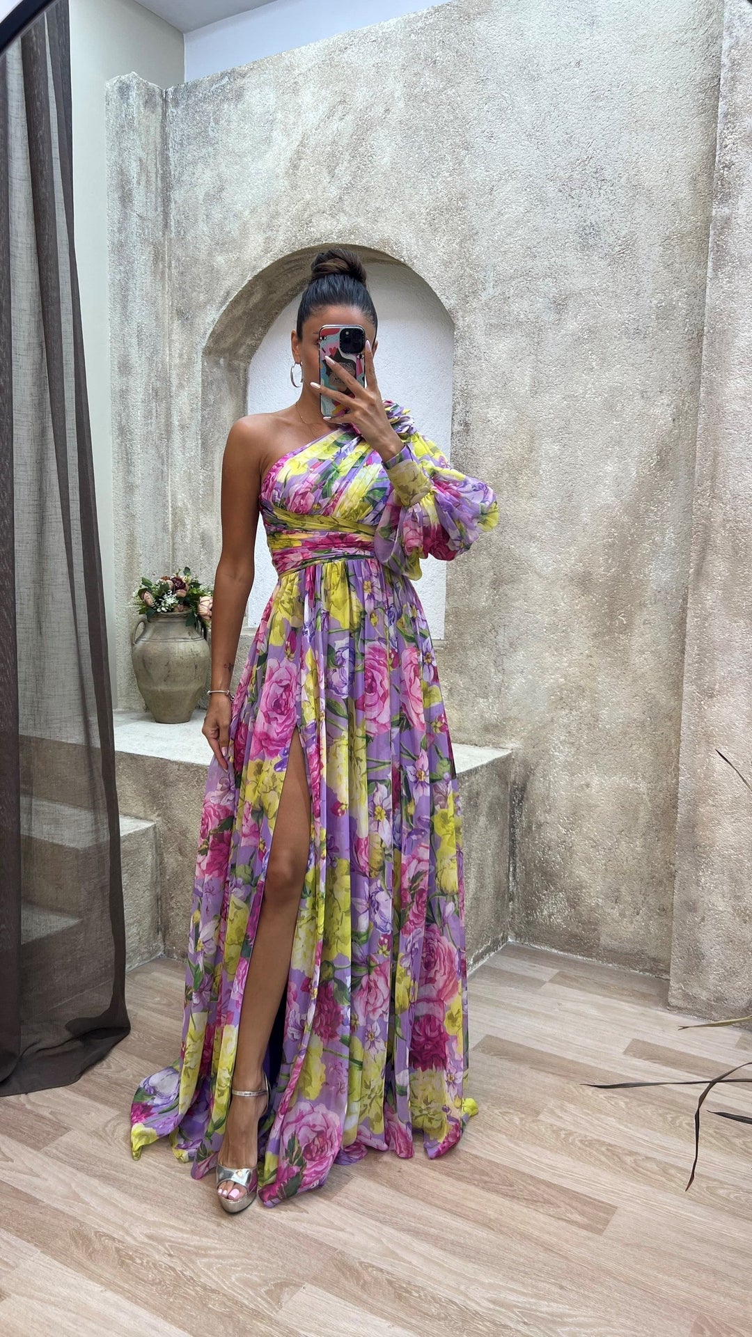 Unique women's one-shoulder flowy maxi dress with vibrant floral print, comfortable for elegant summer evening wear.