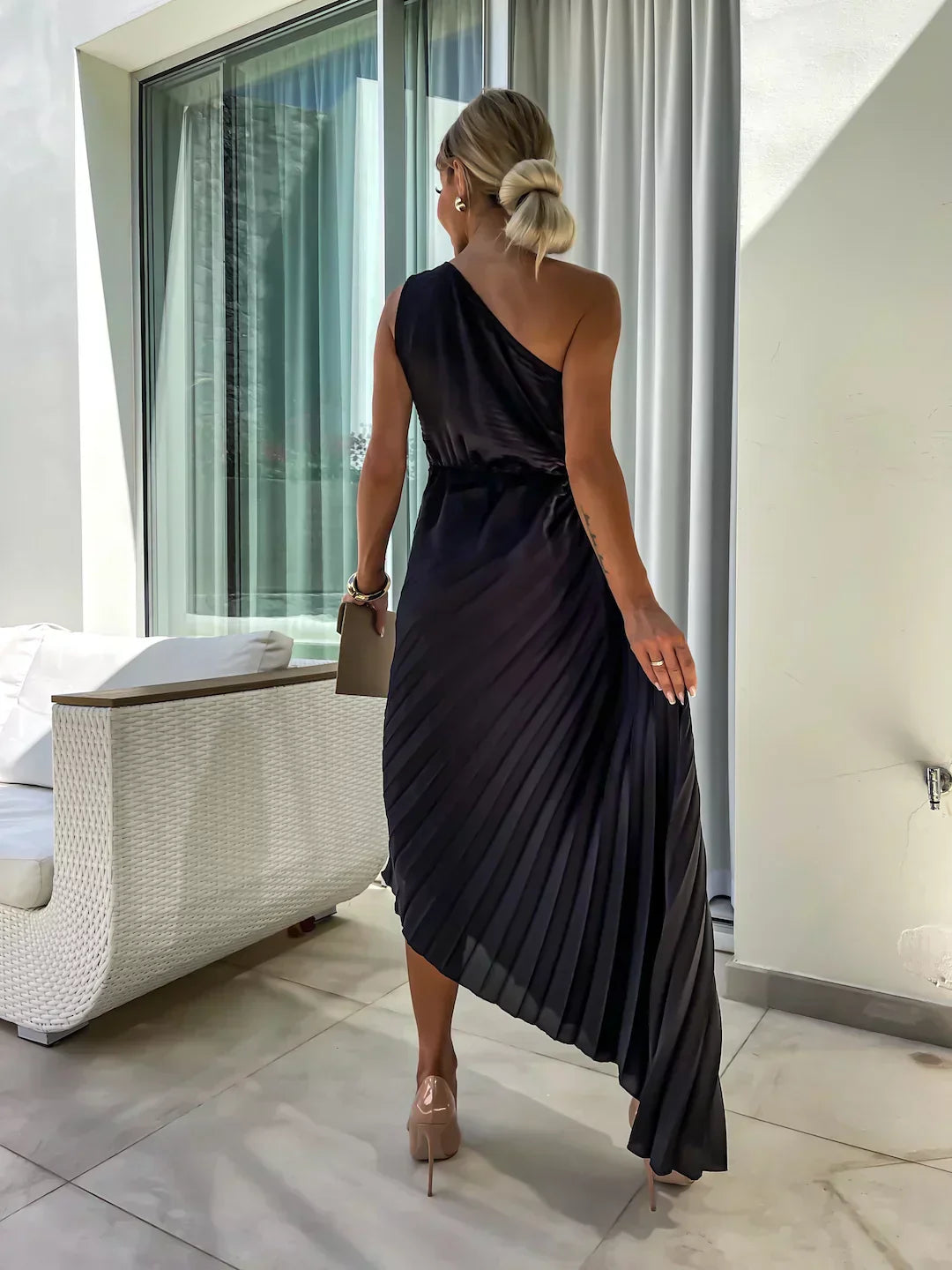 Modern women's cocktail dress: chic one-shoulder pleated midi for special occasions.