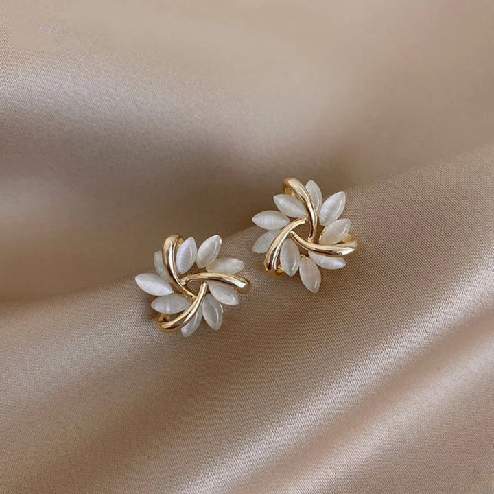 Elegant women's opal flower earrings in gold & silver. Delicate floral gemstone jewelry, perfect gift for her.