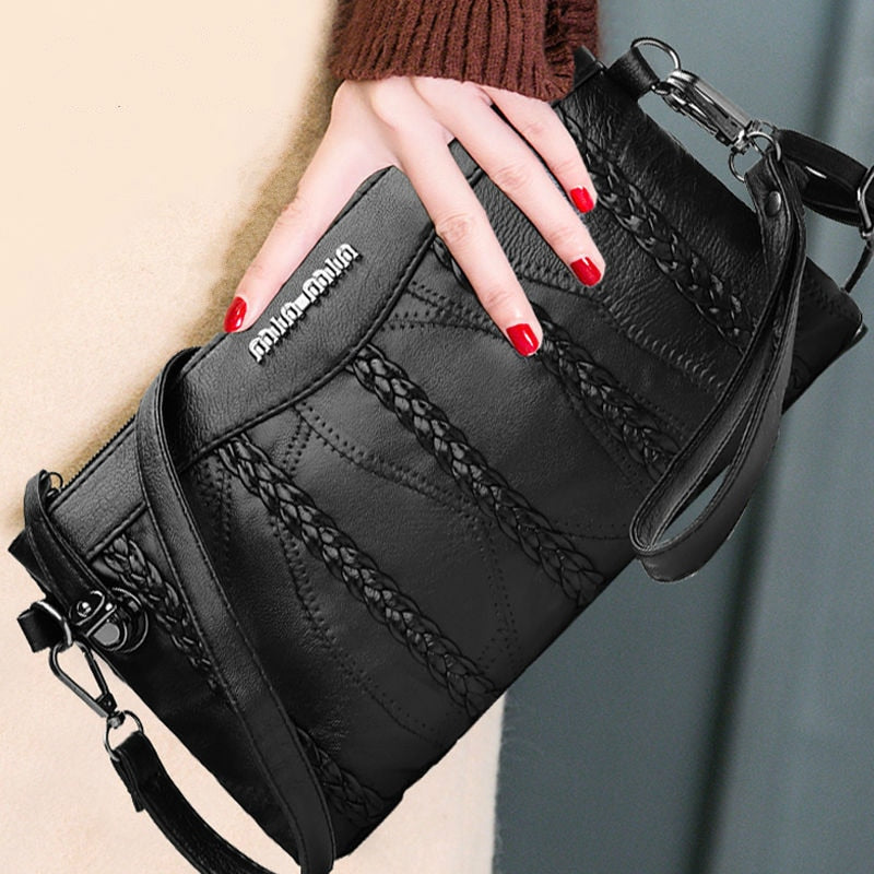 Smooth PU leather women's clutch bag with a sleek finish, perfect as a versatile shoulder or crossbody purse.