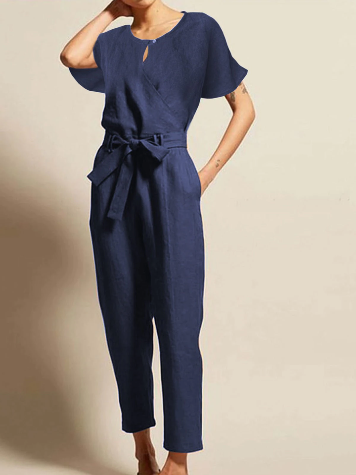 Stylish women's belted summer jumpsuit with short sleeves. A versatile & radiant one-piece for elegant comfort.