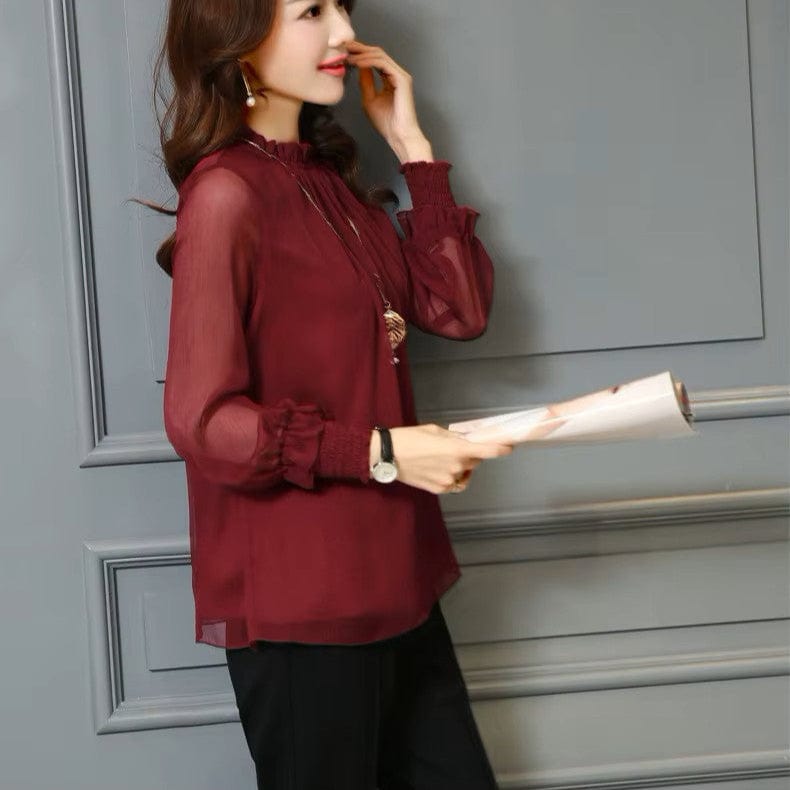 Stylish women's blouse with delicate ruffles and transparent puff sleeves, ideal for elegant summer style.