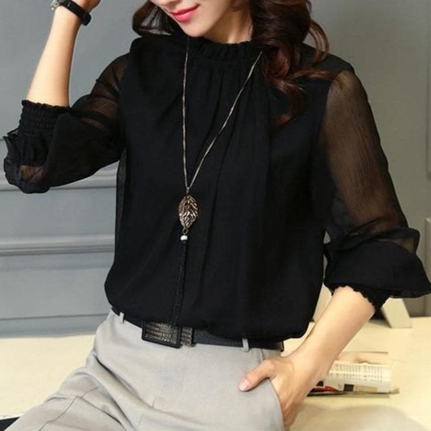 Elina ruffle blouse with elegant sheer puff sleeves, a perfect feminine shirt for spring and summer.