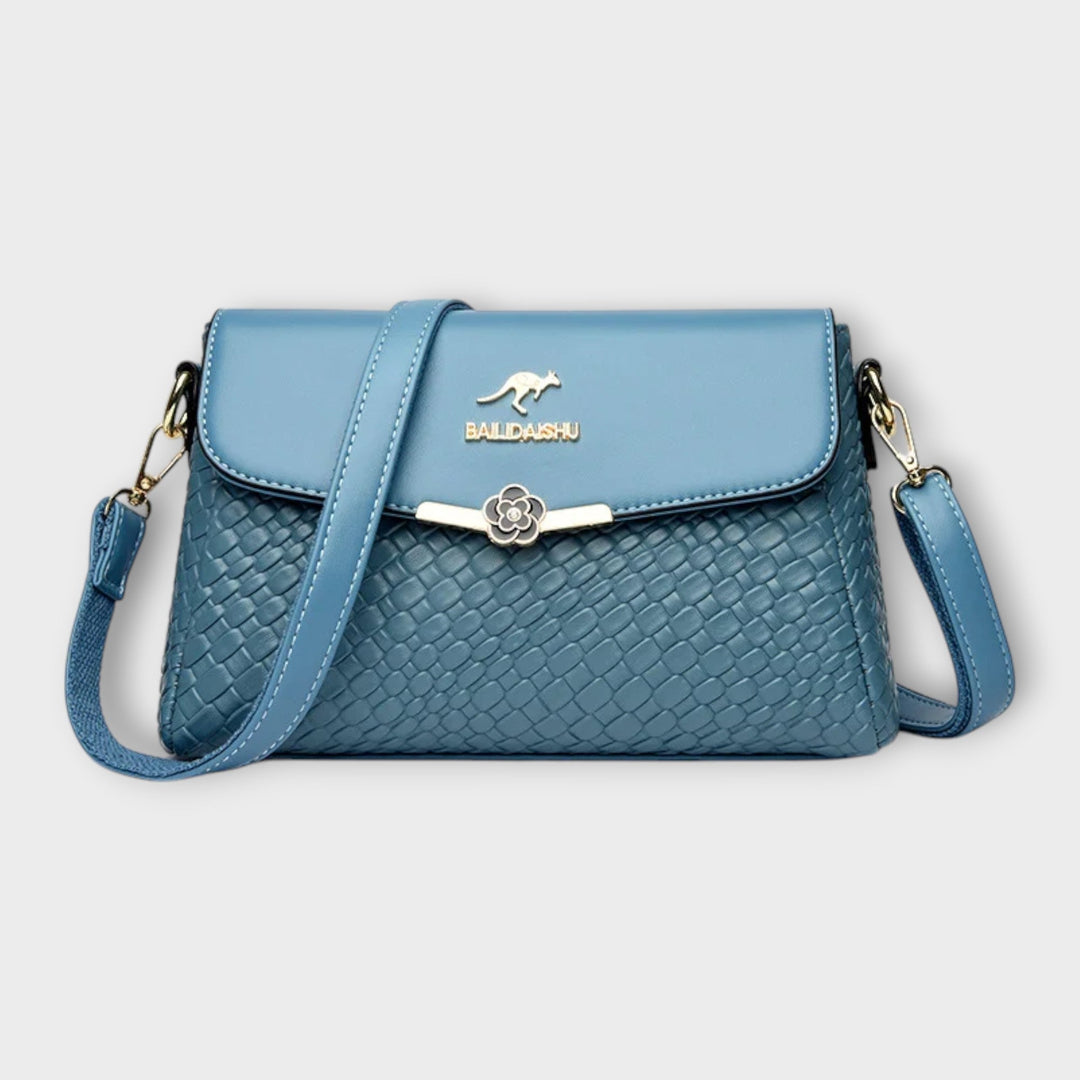 Stylish women's handbag, an elegant fashion accessory with a spacious and organized interior for daily essentials.