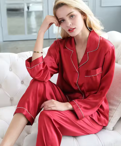 Two-piece women's silken pajama set, designed for luxurious comfort and stylish sleepwear. Ideal for lounging.