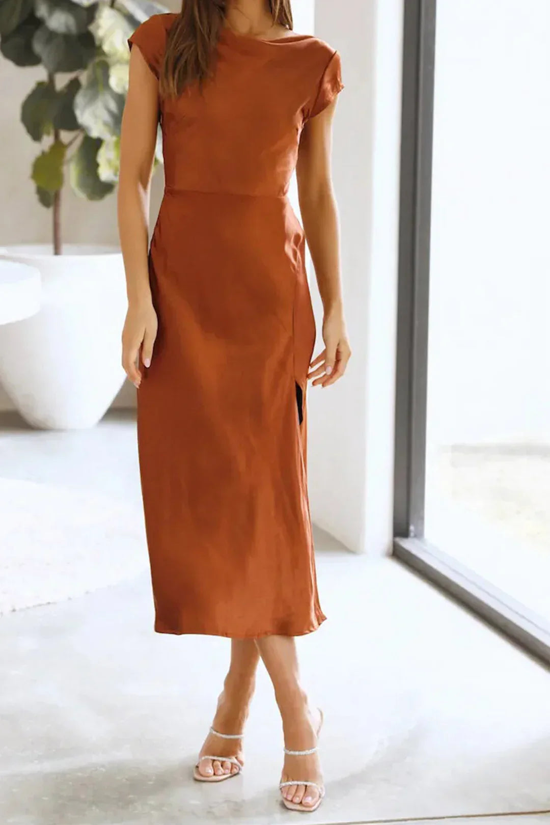 Timeless women's midi slip dress, perfect for special occasions, cocktail events, or elegant summer parties.