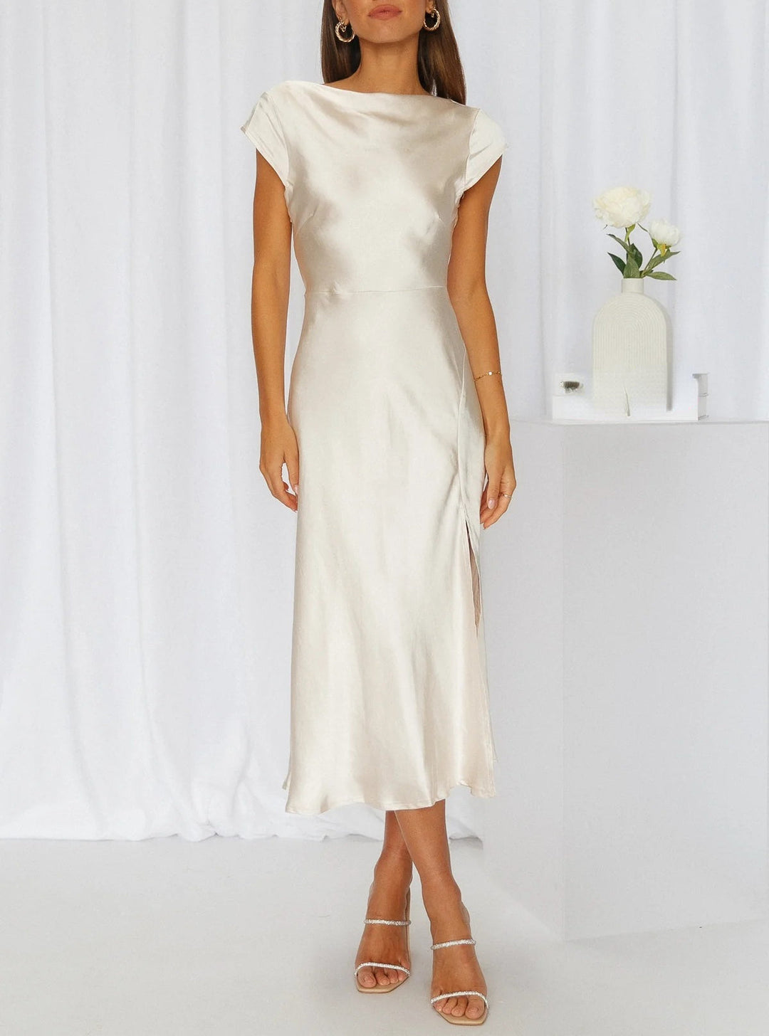 Sleek women's elegant slip midi dress, ideal for formal evening wear & sophisticated special occasions.