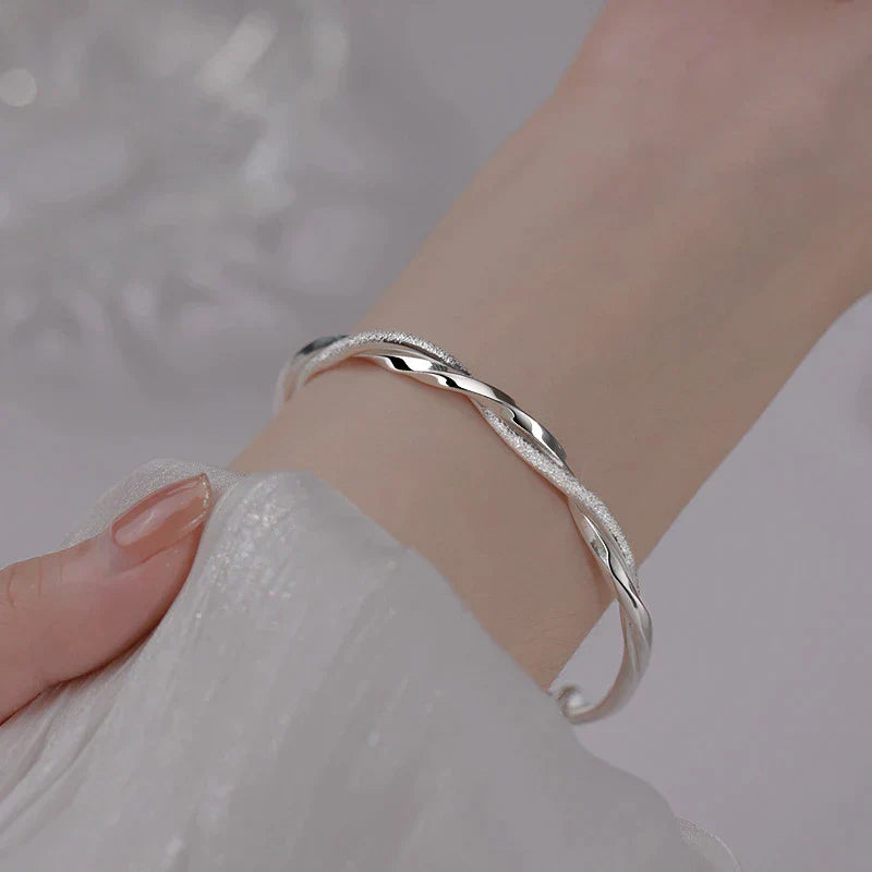 Elegant women's sterling silver bracelet with intricate design, a perfect fashion accessory.