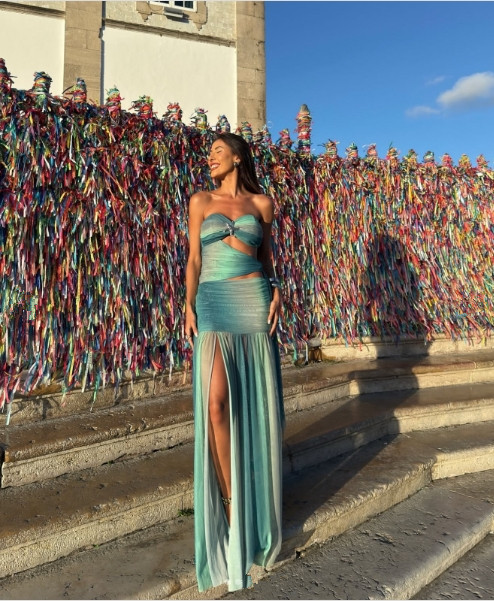 Chic women's strapless long summer dress. An elegant maxi gown for evening, party, or a wedding guest occasion.