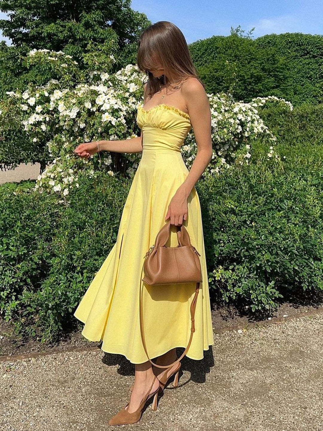 Elegant women's strapless midi summer dress for romantic occasions. Feminine sundress, perfect for parties.