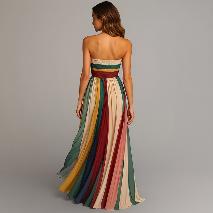 Stylish women's strapless pleated maxi dress featuring a flowing, multicolor fabric. An elegant long dress for summer.
