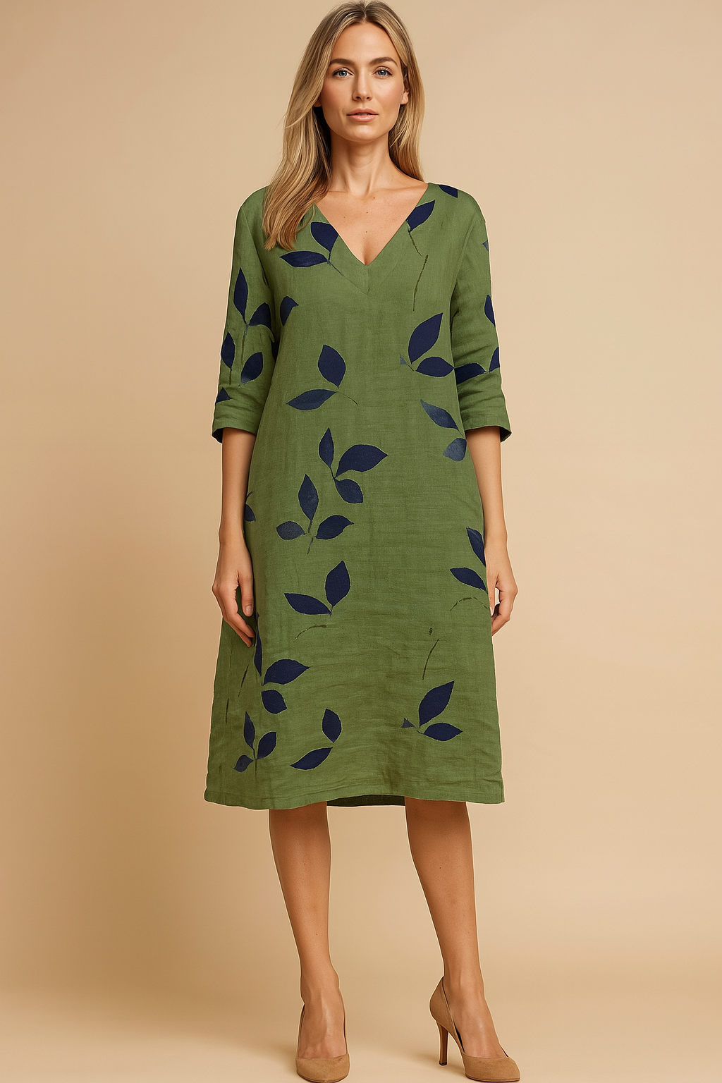 Elegant women's summer midi dress with a stylish leaf pattern, perfect for casual or vacation wear.