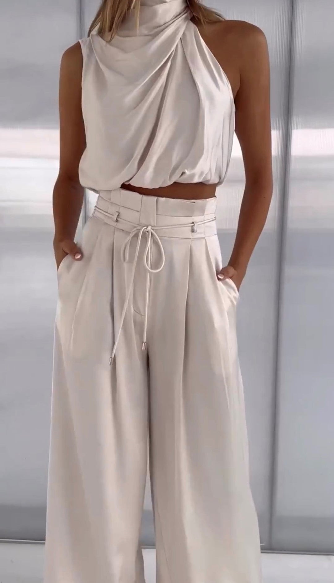 Elegant women's two-piece lounge set in soft cotton linen, perfect for comfortable casual wear.