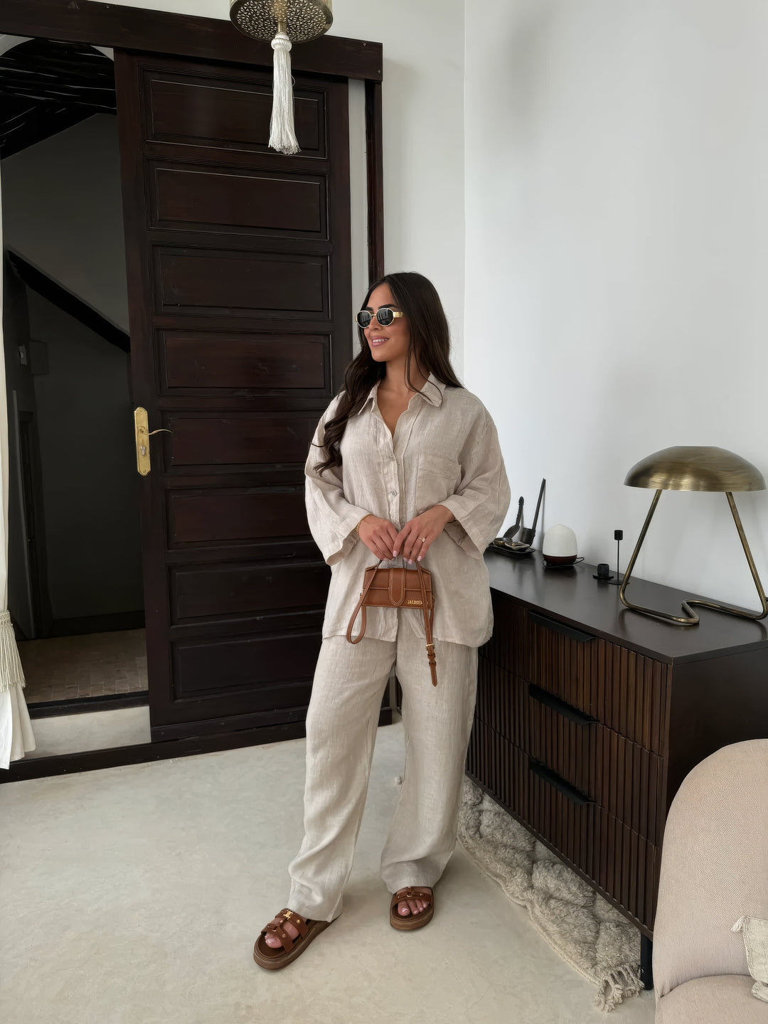 Elegant women's two-piece loungewear set with long sleeve top & wide-leg pants for comfortable casual wear.