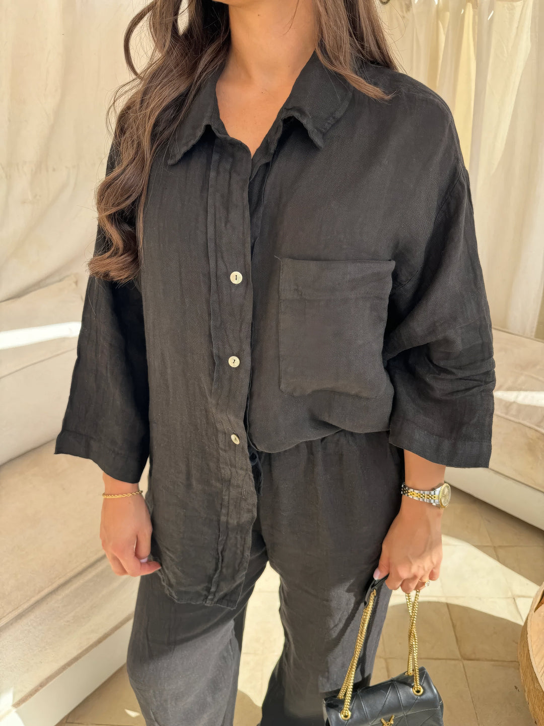 Women's elegant long sleeve top and wide-leg pants matching set, perfect for comfortable and stylish casual wear.