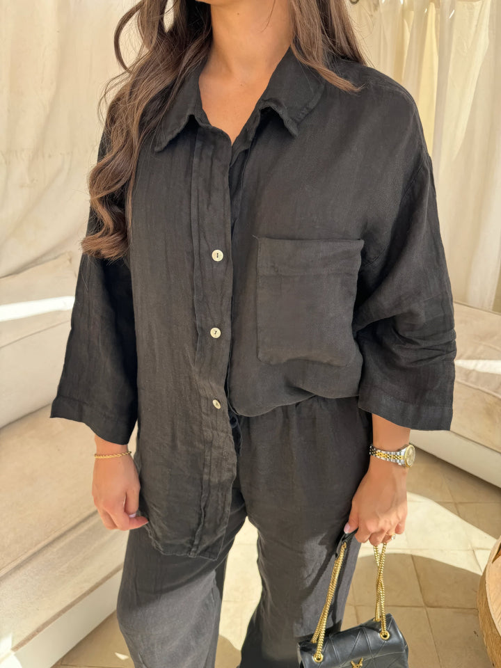 Women's elegant long sleeve top and wide-leg pants matching set, perfect for comfortable and stylish casual wear.