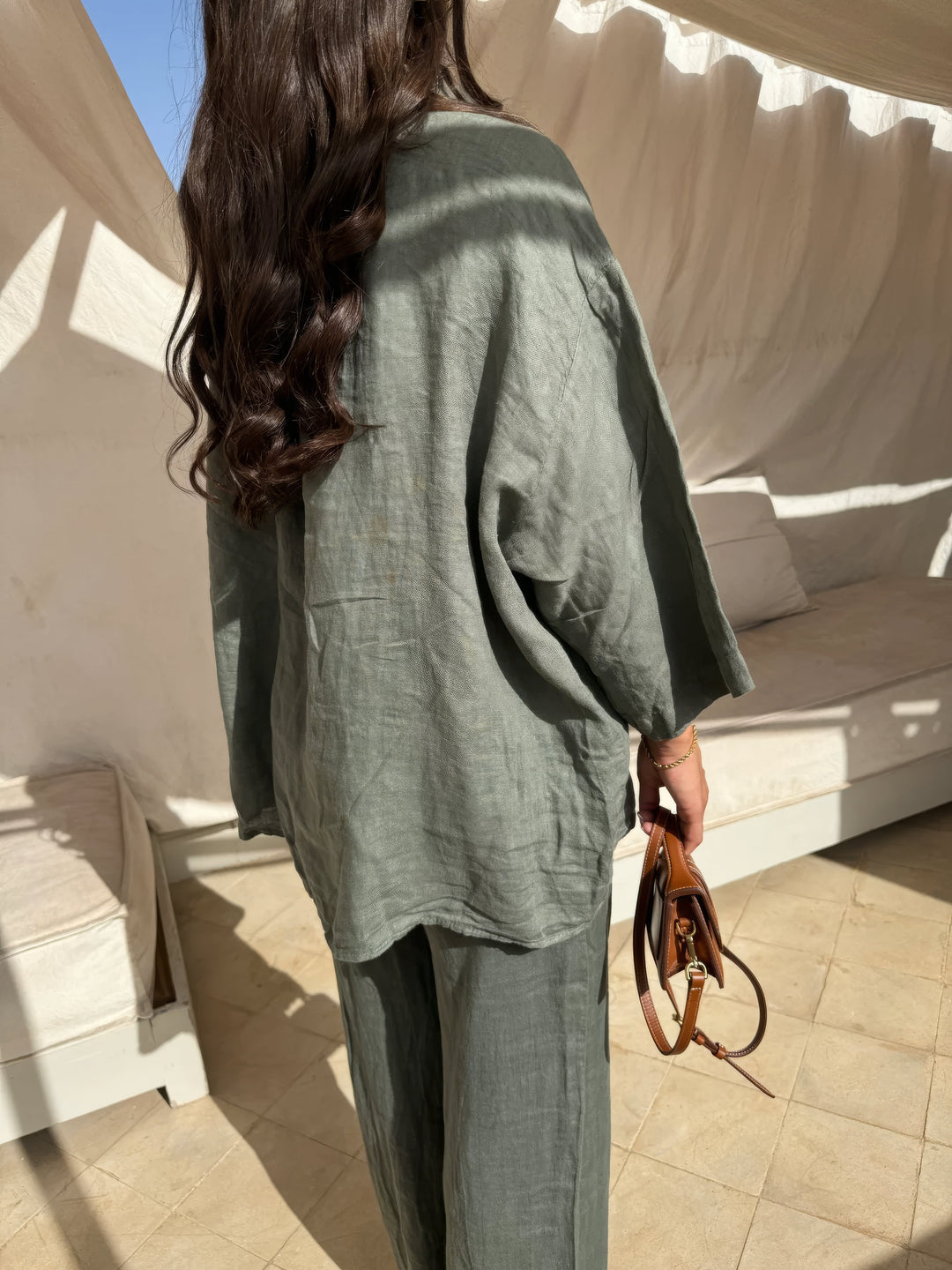 Fashionable women's two-piece outfit with elegant long sleeve top & wide-leg pants, ideal for summer casual wear.