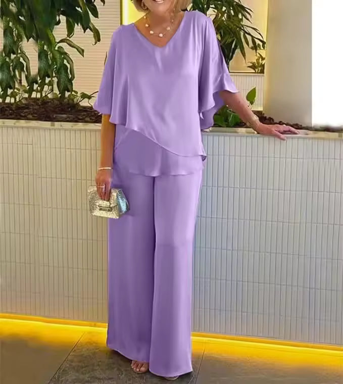 Stylish women's two-piece set featuring breathable fabric & flowing trousers for versatile, comfortable wear.