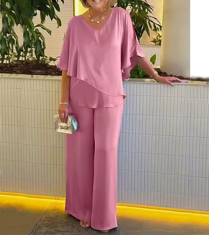 Chic women's two-piece set with elegant top & flowing wide-leg trousers. Versatile, coordinated fashion.