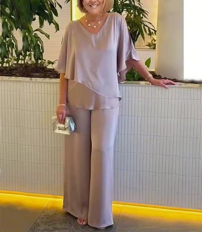 Women's elegant two-piece outfit showcasing flowing trousers & a stylish top, ideal for comfortable wear.