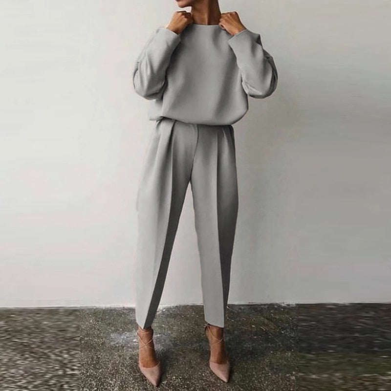 Chic women's matching two-piece suit set. Elegant & comfortable for office wear or stylish casual occasions.