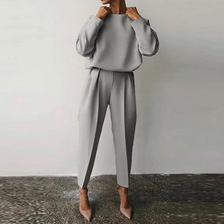 Chic women's matching two-piece suit set. Elegant & comfortable for office wear or stylish casual occasions.