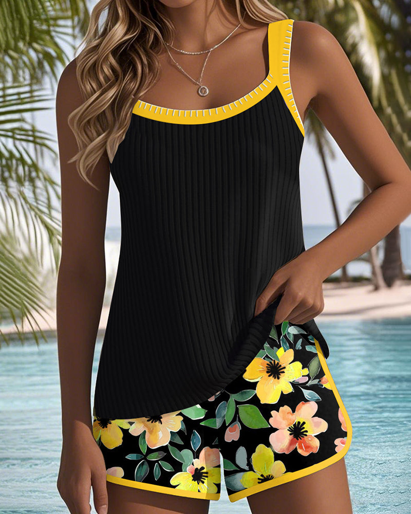 Woman models an elegant two-piece tankini swimsuit set, ready for beach fun.