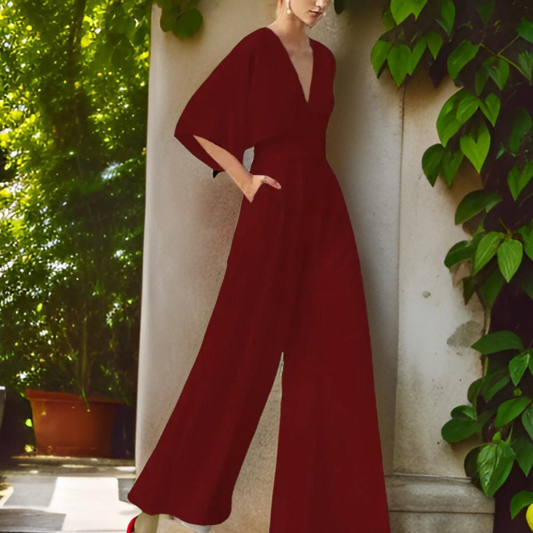 Versatile women's V-neck 3/4 sleeve jumpsuit. Chic & comfortable for everyday or elegant occasion wear.
