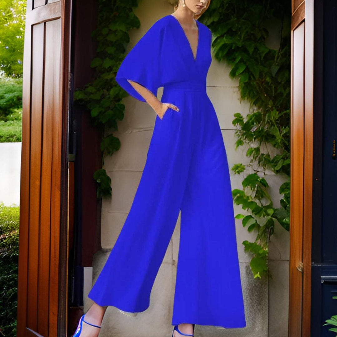 Chic women's V-neck 3/4 sleeve jumpsuit, ideal as an elegant party outfit or stylish occasion wear. Comfortable.