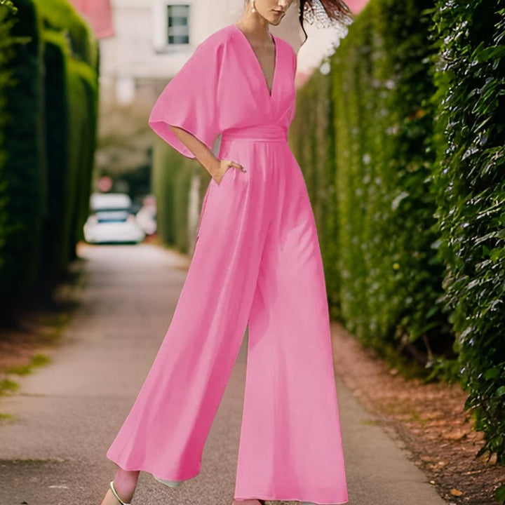 Comfortable women's V-neck jumpsuit with 3/4 sleeves. A chic and versatile choice for casual summer fashion.