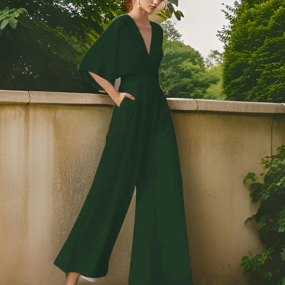 Aurora Chic women's V-neck 3/4 sleeve jumpsuit. Elegant, comfortable, and versatile for any occasion.