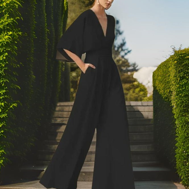 Women's elegant V-neck 3/4 sleeve jumpsuit. A versatile and comfortable clothing item for summer parties & casual wear.