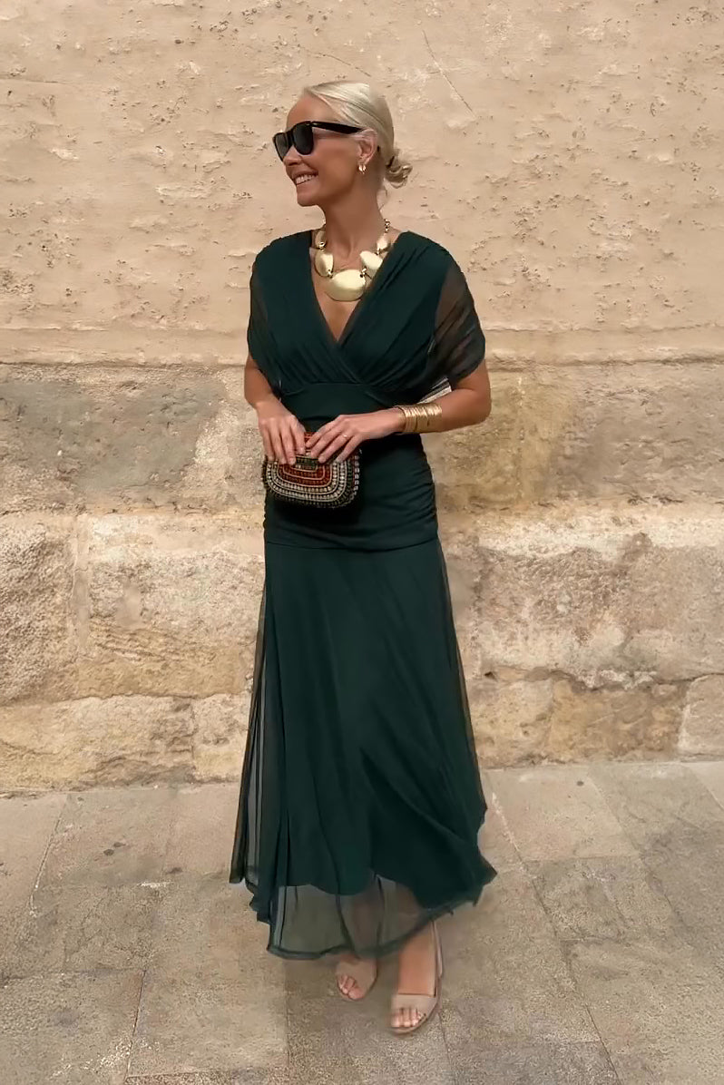 Elegant women's V-neck maxi party dress with flowing fantasy print, perfect for sophisticated occasion wear.