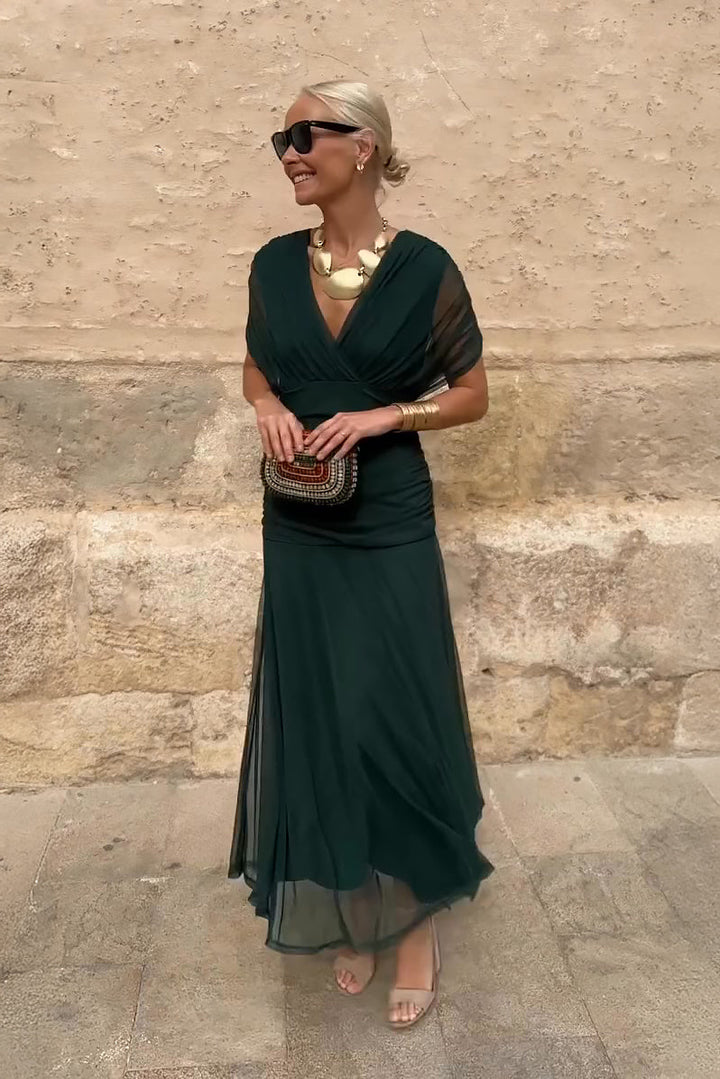 Elegant women's V-neck maxi party dress with flowing fantasy print, perfect for sophisticated occasion wear.