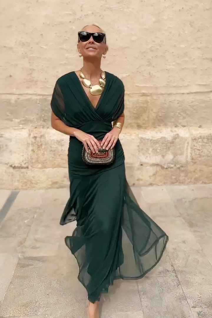 Chic women's V-neck maxi dress, elegant fantasy print, flowing silhouette for sophisticated party occasions.