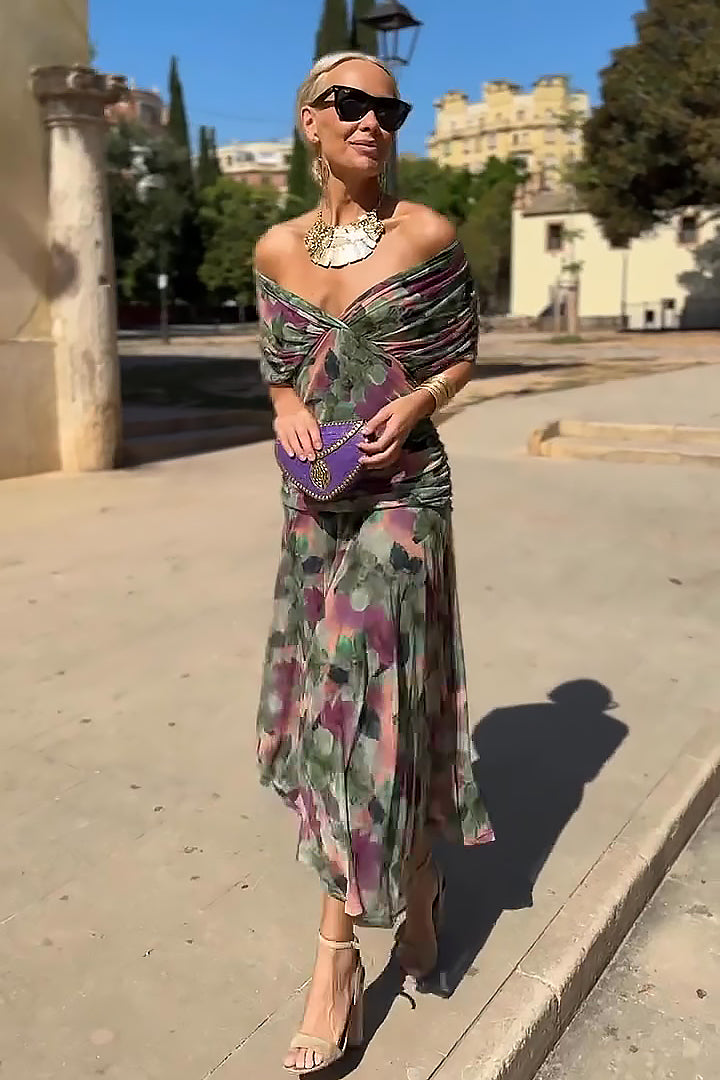 Sophisticated women's maxi dress with unique fantasy print, elegant V-neck, and flowing design for parties.