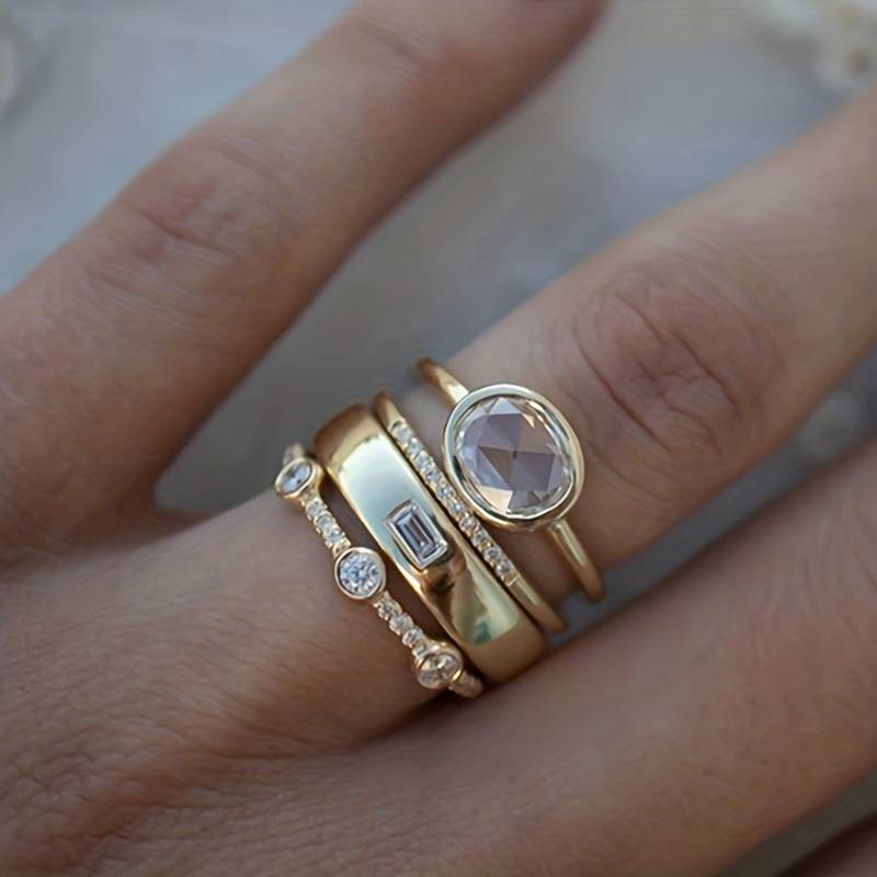 Elegant women's vintage gold & zirconia stacking rings. Timeless gold jewelry set with sparkling zirconia.