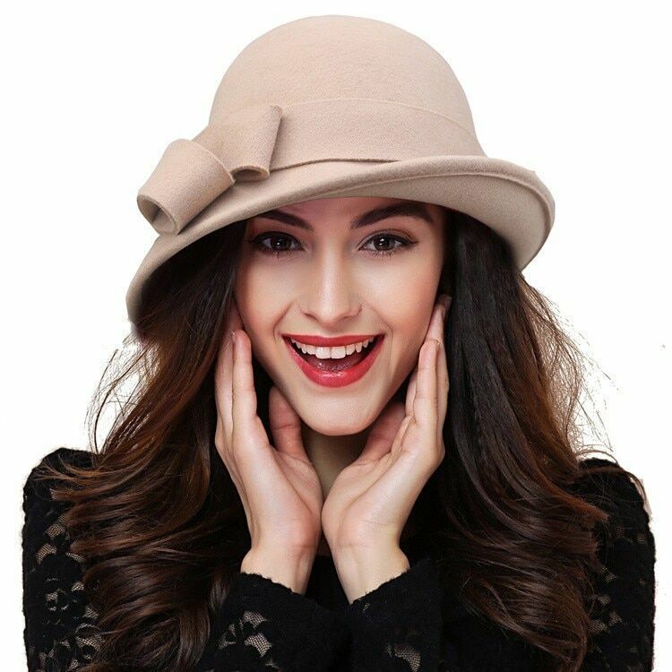 Stylish women's wool fedora in vintage design with a chic ribbon, ideal winter accessory for elegant fashion.