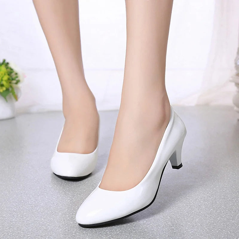 Elegant women's white classic pump heels with a pointed toe, perfect for work, weddings, and formal events.