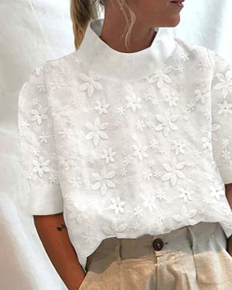 Elegant women's white embroidered blouse with stand-up collar & long sleeves, perfect for sophisticated office wear.