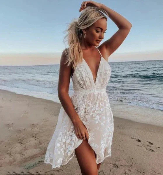 Elegant women's white halter mini cocktail dress with V-neck, perfect for beach parties & summer weddings.