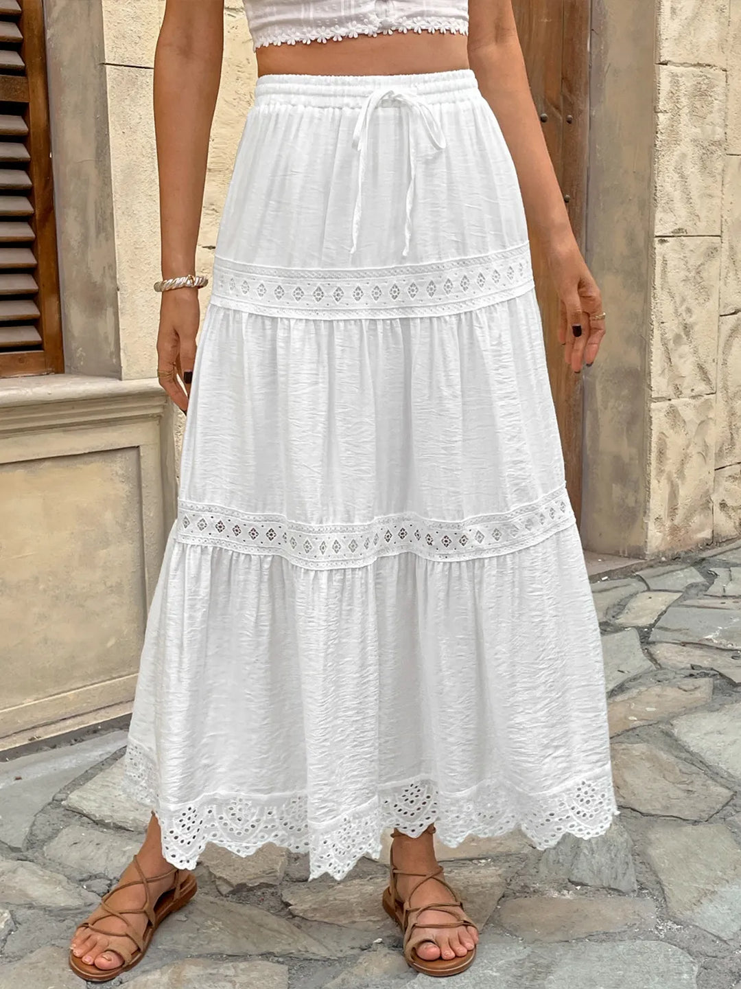 Elegant women's white lace maxi skirt, perfect for summer events & beach vacations. Flowy & stylish.