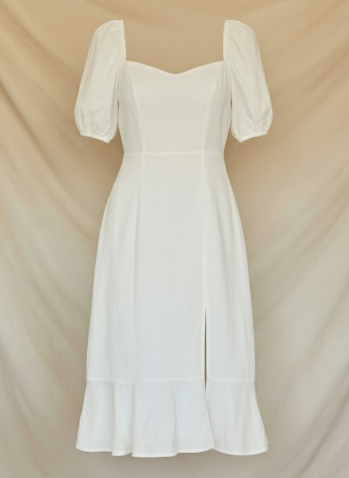 Chic women's puff sleeve midi dress in white, ideal for a wedding guest, cocktail party, or summer event.