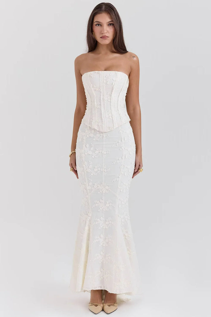 Beautiful white strapless maxi dress for women, featuring intricate embroidery for a sophisticated formal look.