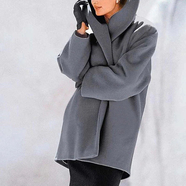 Warm women's insulated wool jacket, button-down and hip-length. Stylish and elegant outerwear for winter fashion.