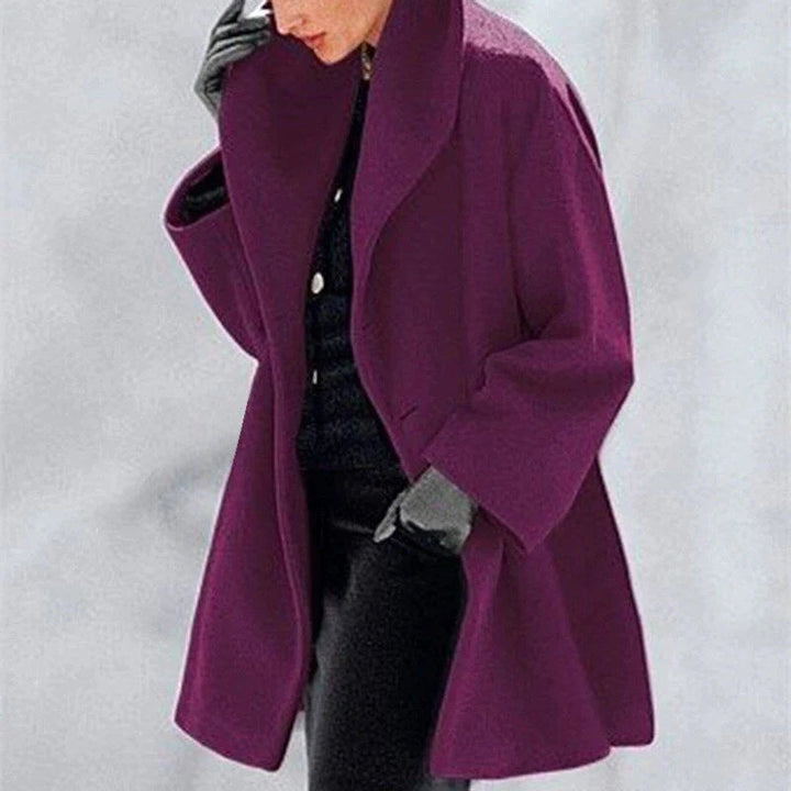 Warm women's wool winter coat, elegant and insulated. Chic button-down, hip-length jacket for seasonal ladies fashion.