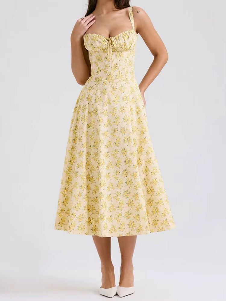 Elegant women's yellow floral summer midi dress. Flowy fabric, perfect for summer parties & vacations.