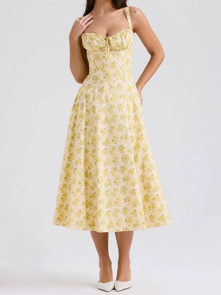 Elegant women's yellow floral summer midi dress. Flowy fabric, perfect for summer parties & vacations.
