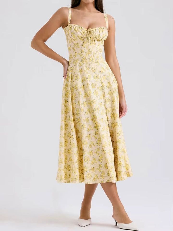 Vibrant yellow floral midi dress for women, an elegant choice for summer fashion and holiday wear.